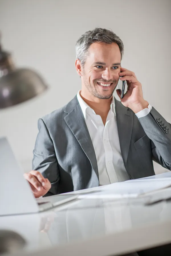 Focus-Issues-Treatment A man takes care of a call at work. Get treatment for focus issues from Morgan Burns, APRN in Central Florida.