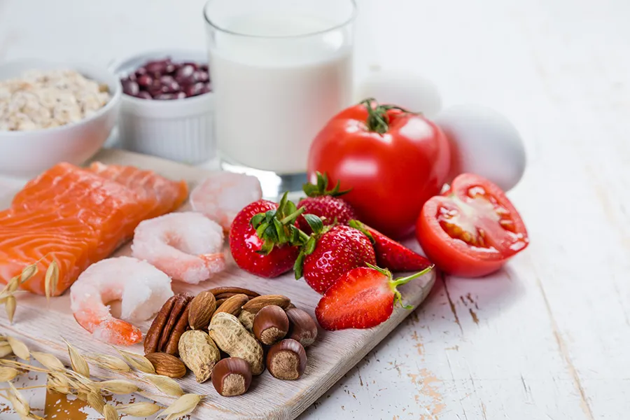 Food-Allergies-Clinic A board of foods like nuts, shellfish, and dairy, that are commonly associated with allergies. Get treatment for food allergies from Morgan Burns, APRN in Central Florida.