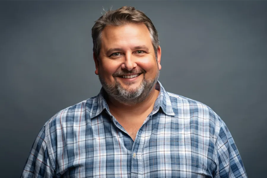 High-Cholesterol-Clinic A happy, slightly overweight man with a beard. Get treatment for high cholesterol from Morgan Burns, APRN in Central Florida.