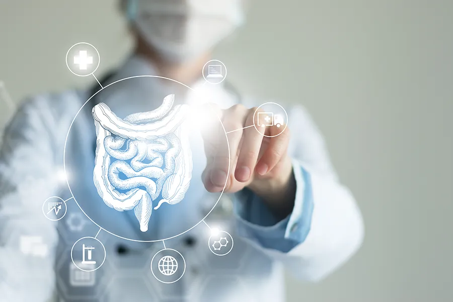 Leaky-Gut-Syndrome-Clinic Morgan Burns, APRN provides advanced Functional Medicine for Leaky Gut Syndrome treatments in Central Florida, shown by a doctor touching a glowing digital intestinal health display.