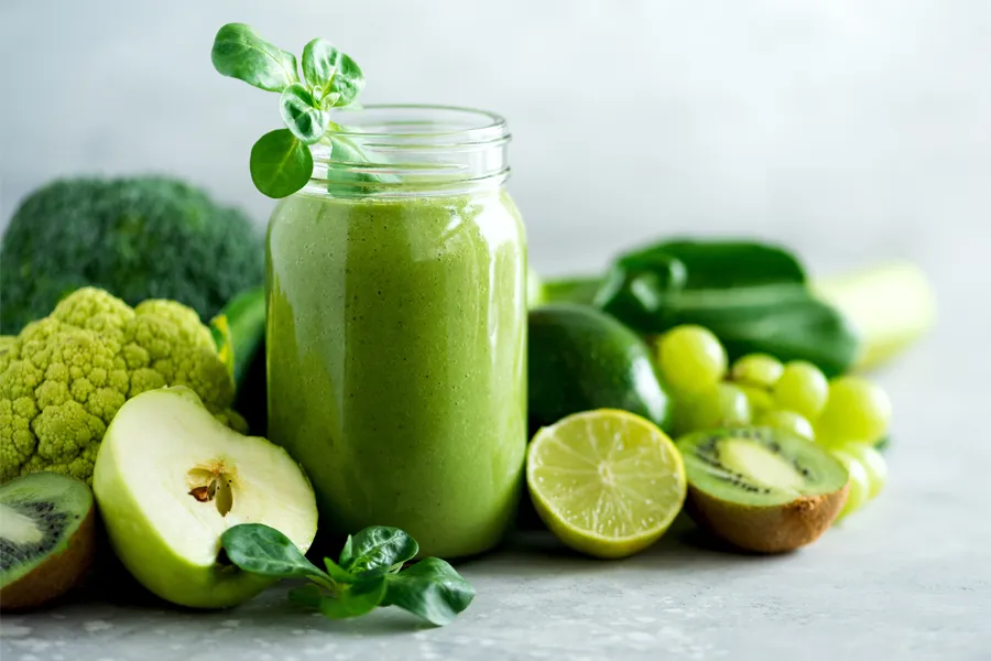 Nutritional-Counseling-Clinic A tableau of healthy green fruits and vegetables and juices. Get nutritional counseling from Morgan Burns, APRN in Central Florida.