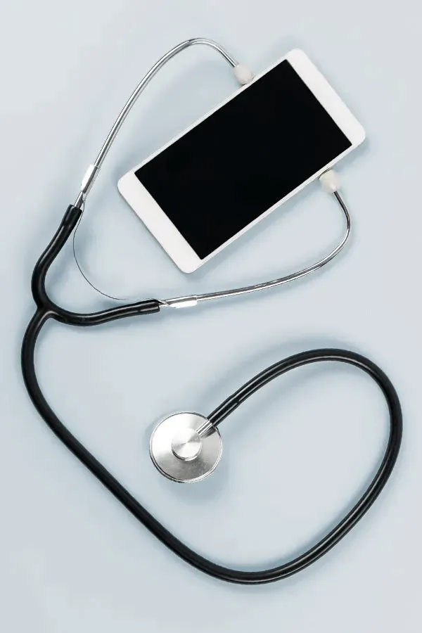 Telemedicine-Treatment A smartphone with a stethoscope attached to it, symbolizing Telemedicine treatment from Morgan Burns, APRN in Central Florida.