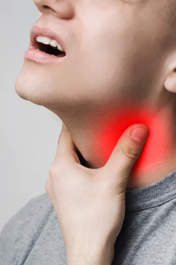 Thyroid-Treatment A man holds his throat in pain. Get thryoid testing from Morgan Burns, APRN in Central Florida.